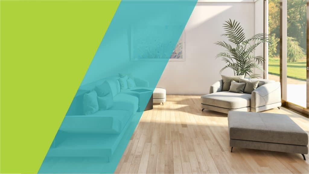 Un salon lumineux et moderne avec un canapé, une table basse, et une grande fenêtre donnant sur un extérieur verdoyant, illustrant un cadre de vie agréable.